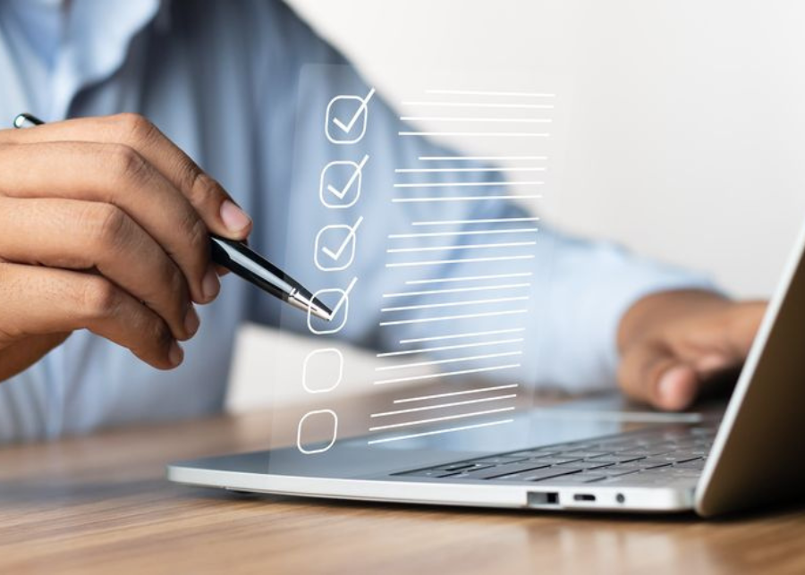 Business consultant assisting with online approvals